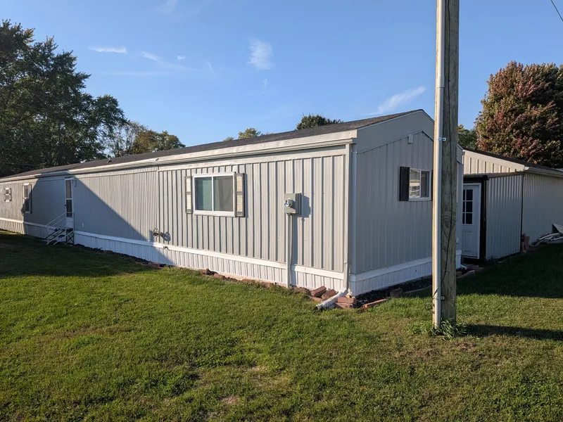 Side of the home with the new windows